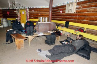 Sunday March 11, 2012   Nicholas Petit lays down for a nap inside the community center at the Kaltag checkpoint. Iditarod 2012.