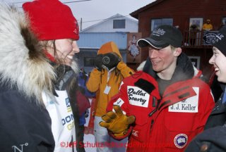 Tuesday March 13, 2012  First place finisher, Dallas Seavey (R) congratulates second place finisher Aliy Zirkle  shortly after she crossed the finish line Nome. Iditarod 2012.