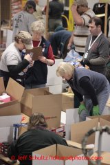 Friday, February 15, 2013.   Volunteers sort and pack an assortment of 