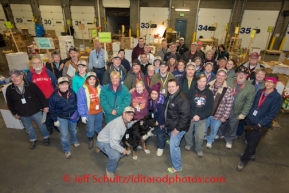 A group photo of the volunteers at the Airland Transport's sort facility during the people food drop. Friday February 14, 2014.  Iditarod Sled Dog Race 2014PHOTO BY JEFF SCHULTZ/IDITARODPHOTOS.COM  USE ONLY WITH PERMISSION