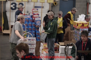 Friday, February 15, 2013.   Volunteers sort and pack an assortment of