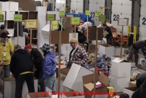 Friday, February 15, 2013.   Volunteers sort and pack an assortment of