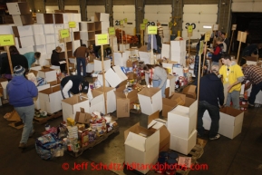 Friday, February 15, 2013.   Volunteers sort and pack an assortment of