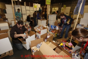 Friday, February 15, 2013.   Volunteers Garrett Egeberg and Cheryl Zachary sort and pack an assortment of