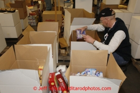 Friday, February 15, 2013.   Volunteer Steve Lambert packs food boxes at the