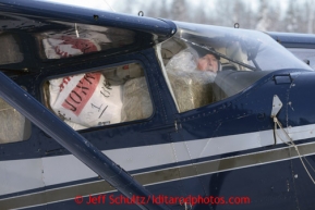 February 16, 2013  Volunteer Iditarod Air Force pilot Bill Mayer taxis with a load bound for Rainy Pass at the Willow airport as musher food, straw, HEET and people food is flown to the 4 checkpoints on the east side the Alaska Range. Iditarod 2013 Photo Copyright Jeff Schultz  -- Do not reproduce without written permission