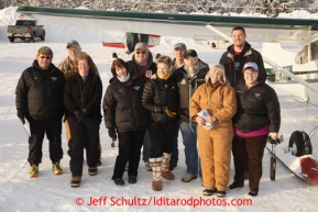 February 16, 2013  Logistics volunteers pose for a photo at the Willow airport during the first day of the