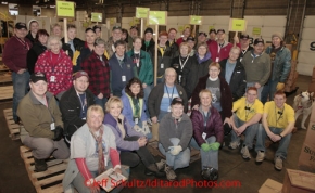 Friday February 17, 2012   Volunteers stop to pose for a group photo before they begin to sort and package the human food for shipment to the 22 checkpoints on the Iditarod.  This food is donated by long-time sponsor Fred Meyer and will be consumed by the trail volunteers who man the chekpoints during the race.