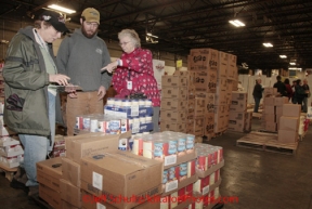 Friday February 17, 2012   Volunteers sort and package the human food and supplies for shipment to the 22 checkpoints on the Iditarod.  This food is donated by long-time sponsor Fred Meyer and will be consumed by the trail volunteers who man the chekpoints during the race.