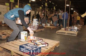 Friday February 17, 2012   Volunteers sort and package the human food and supplies for shipment to the 22 checkpoints on the Iditarod.  This food is donated by long-time sponsor Fred Meyer and will be consumed by the trail volunteers who man the chekpoints during the race.