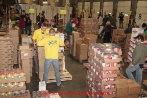 Friday February 17, 2012   Volunteers sort and package the human food and supplies for shipment to the 22 checkpoints on the Iditarod.  This food is donated by long-time sponsor Fred Meyer and will be consumed by the trail volunteers who man the chekpoints during the race.