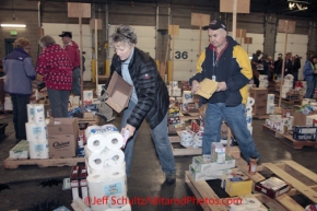 Friday February 17, 2012   Volunteers sort and package the human food and supplies for shipment to the 22 checkpoints on the Iditarod.  This food is donated by long-time sponsor Fred Meyer and will be consumed by the trail volunteers who man the chekpoints during the race.