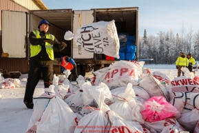 Zach Steer helps unload musher bags as the Iditarod Air Force pilots and logistics volunteers load planes with food and supplies for checkpoints on Saturday February 17th  at the Willow Airport in Willow, Alaska  Iditarod 2018Photo by Judy Patrick/SchultzPhoto.com  (C) 2018  ALL RIGHTS RESERVED