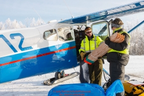 Volunteer load coordinator Leslie Washburn helps pilot Scott Ivany load his plane with trail markers as the Iditarod Air Force flies out food and supplies to checkpoints on Saturday February 17th  before the 2018 race from the Willow airport in Willow, Alaska Photo by Judy Patrick/SchultzPhoto.com  (C) 2018  ALL RIGHTS RESERVED