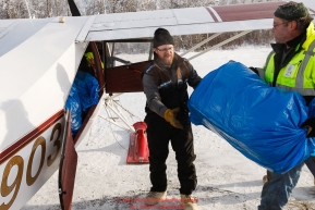 Pilots load a plane as the Iditarod Air Force flies out food and supplies to checkpoints on Saturday February 17th  before the 2018 race from the Willow airport in Willow, Alaska Photo by Judy Patrick/SchultzPhoto.com  (C) 2018  ALL RIGHTS RESERVED