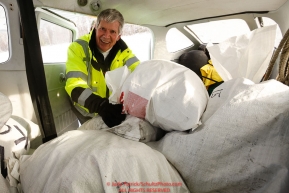 Volunteer pilot Mike Swalling loads his Cessna 206 with musher food bags as the Iditarod Air Force flies out food and supplies to checkpoints on Saturday February 17th before the 2018 race from the Willow airport in Willow, Alaska Photo by Judy Patrick/SchultzPhoto.com  (C) 2018  ALL RIGHTS RESERVED
