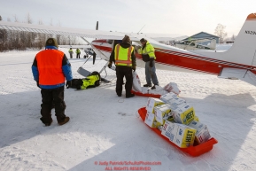 Volunteers help load a plane as the Iditarod Air Force flies out food and supplies to checkpoints before the 2018 race from the Willow airport in Willow, Alaska Photo by Judy Patrick/SchultzPhoto.com  (C) 2018  ALL RIGHTS RESERVED