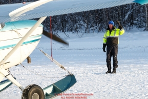 Pilot Russ Dunalp marshals out a plane as the Iditarod Air Force flies out food and supplies to checkpoints on Saturday February 17th  before the 2018 race from the Willow airport in Willow, Alaska Photo by Judy Patrick/SchultzPhoto.com  (C) 2018  ALL RIGHTS RESERVED