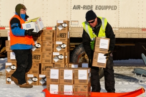 Logistics volunteers Chris Blankenship and Dean Collison move HEET to Iditarod Air Force planes as they fly out food and supplies to checkpoints before the 2018 race from the Willow airport in Willow, Alaska Photo by Judy Patrick/SchultzPhoto.com  (C) 2018  ALL RIGHTS RESERVED