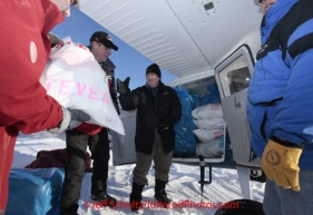 Saturday February 18, 2012   Volunteers help load Mike Swalling's Cessna 206  at the Willow airport as the straw, musher food bags, lathe, people food and supplies begin to be flown out by the Iditarod volunteer Air Force  to checkpoints along the trail.