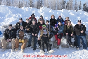 Saturday February 18, 2012   Iditarod volunteers including Air Force support and loaders pose for a photo at the Willow airport as the straw, musher food bags, lathe, people food and supplies begin to be flown out by the Iditarod volunteer Air Force  to checkpoints along the trail.