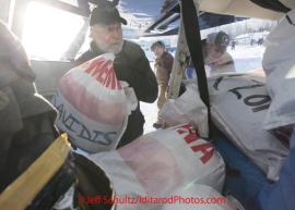 Saturday February 18, 2012   Volunteer pilot Dr. Bill Mayer loads his Cessna with musher food bags at the Willow airport as the straw, musher food bags, lathe, people food and supplies begin to be flown out by the Iditarod volunteer Air Force  to checkpoints along the trail.