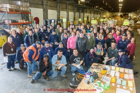 A team of volunteers, including many from the Alaska Military Youth Academy, stop for a group photo during th musher food drop day at Airland Transport warehouse in Anchorage on Wednesday February 18th prior to Iditarod 2015.(C) Jeff Schultz/SchultzPhoto.com - ALL RIGHTS RESERVEDDUPLICATION PROHIBITED WITHOUT PERMISSION