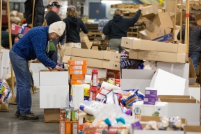 Volunteers sort and pack human food for the volunteers which will be working at the 20+ checkpoints durinig this year's 2016 Iditarod Race at the Airland Transport warehouse in Anchorage on Friday, February 19, 2016.