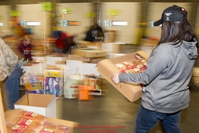 Some of the  food for being sent out on the trail for  the volunteers which will be working at the 20+ checkpoints durinig this year's 2016 Iditarod Race at the Airland Transport warehouse in Anchorage on Friday, February 19, 2016.