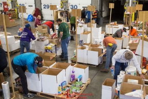 Some of the  food for being sent out on the trail for  the volunteers which will be working at the 20+ checkpoints durinig this year's 2016 Iditarod Race at the Airland Transport warehouse in Anchorage on Friday, February 19, 2016.