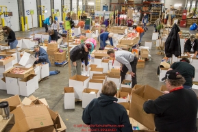 Some of the  food for being sent out on the trail for  the volunteers which will be working at the 20+ checkpoints durinig this year's 2016 Iditarod Race at the Airland Transport warehouse in Anchorage on Friday, February 19, 2016.