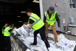 Iditarod volunteers unload musher food drop bags for the 2020 Iditarod Trail Sled Dog Race at Aril Land Transport in Anchorage, AK on Wednesday, February 19, 2020. The bags with food and equipment will be shipped to Iditarod checkpoints along the trail. (Photo by Bob Hallinen)