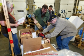 Volunteers sort, stack and box