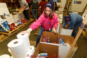 Volunteers sort, stack and box