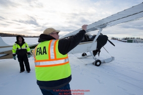 An FAA inspector does a