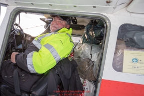 Volunteer Iditarod Air Force pilot, John Norris readies to take a load of supplies to Rainy Pass at the Willow, Alaska airport during the Food Flyout on Saturday, February 20, 2016.  Iditarod 2016