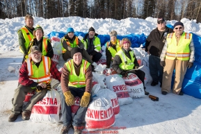 Volunteer loaders pose for a group photo at the Willow, Alaska airport during the Food Flyout on Saturday, February 20, 2016.  Iditarod 2016