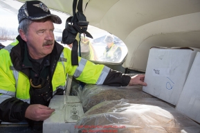 Volunteer Iditarod Air Force pilot, Glen Hanson loads his plane wiht hay, musher drop bags, people food and HEET at the Willow, Alaska airport during the Food Flyout on Saturday, February 20, 2016.  Iditarod 2016