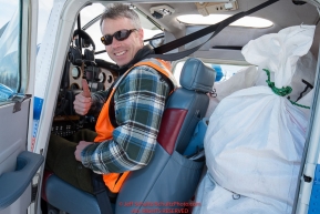 Volunteer Iditarod Air Force pilot, Scott Ivany gives the thumbs up as hee readies to take a plane load of hay, musher drop bags, people food and HEET to Rainy Pass at the Willow, Alaska airport during the Food Flyout on Saturday, February 20, 2016.  Iditarod 2016