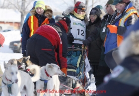 Saturday February 25, 2012  Young Abigail Brooks, daughter of Ramey Brooks gets a hug from Iditarod race coordinator Joanne Potts as she readies to leave the start line at Knik Lake during the Junior Iditarod start.