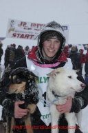 Junior Iditarod champion Conway Seavey (a 3rd generation Seavey dog musher) poses with his lead dogs Memphis (left) and Sarge at the finish line after winning the 2012 Junior Iditarod.