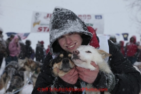 Junior Iditarod champion Conway Seavey (a 3rd generation Seavey dog musher) poses with his lead dogs Memphis (left) and Sarge at the finish line after winning the 2012 Junior Iditarod.