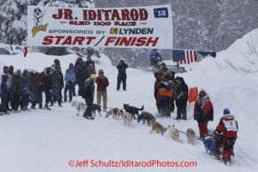 Sunday February 26, 2012   4th place finisher Jesse Klejka crosses the finish line on Willow Lake.