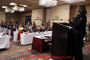 Karen Hagedorn, representing sponsor ExxonMobil wishes the mushers well during the mandatory musher meeting at the Millenium hotel two days prior to the start of Iditarod 2013.   Thursday February 28, 2013Photo (C) Jeff Schultz/IditarodPhotos.com  Do not reproduce without permission