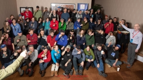 The 52 mushers signed up for the 2019 Iditarod race gather for a group photo and a toast  from hotel manager Greg Beltz at the mandatory musher meeting at the Lakefront Anchorage hotel in Anchorage, Alaska. Thursday February 28, 2019 Photo by Jeff Schultz/  (C) 2019  ALL RIGHTS RESERVED