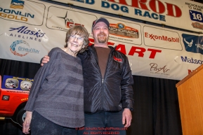 Joanne Potts receives the honorary musher award from Aaron Burmeister at the 2016 Iditarod musher position drawing banquet at the Dena'ina convention center in Anchorage, Alaska on Thursday March 3, 2016  Â© Jeff Schultz/SchultzPhoto.com ALL RIGHTS RESERVEDDO NOT REPRODUCE WITHOUT PERMISSION