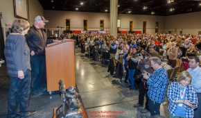 Joanne Potts gets a standing ovation as she receives the honorary musher award from Aaron Burmeister at the 2016 Iditarod musher position drawing banquet at the Dena'ina convention center in Anchorage, Alaska on Thursday March 3, 2016  Â© Jeff Schultz/SchultzPhoto.com ALL RIGHTS RESERVEDDO NOT REPRODUCE WITHOUT PERMISSION