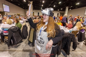 Volunteer Karen Tallent pushes Iditarod raffle tickets at the 2016 Iditarod musher position drawing banquet at the Dena'ina convention center in Anchorage, Alaska on Thursday March 3, 2016  Â© Jeff Schultz/SchultzPhoto.com ALL RIGHTS RESERVEDDO NOT REPRODUCE WITHOUT PERMISSION