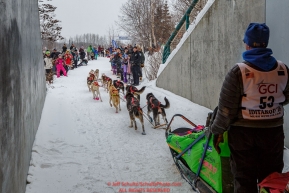Alan Eischens exits an overpass tunnel on the bike/ski trail  as spectators line the trail during the ceremonial start day of the 2018 Iditarod in Anchorage, Alaska on Saturday, March 3 2018.Photo by Jeff Schultz/SchultzPhoto.com  (C) 2018  ALL RIGHTS RESERVED