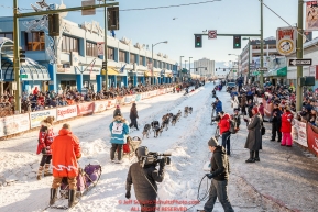 Musher Misha Wiljes runs down 4th avenue during the Ceremonial Start of the 2017 Iditarod in Anchorage on Saturday March 4, 2017 Photo by Jeff Schultz/SchultzPhoto.com  (C) 2017  ALL RIGHTS RESVERVED